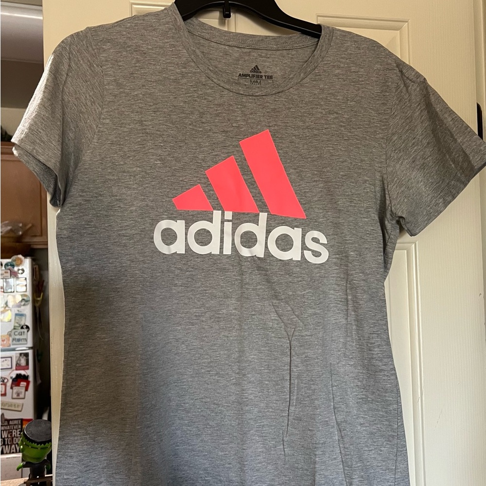 Women’s Adidas t-shirt. New, never worn. Size Medium. Discounted shipping!